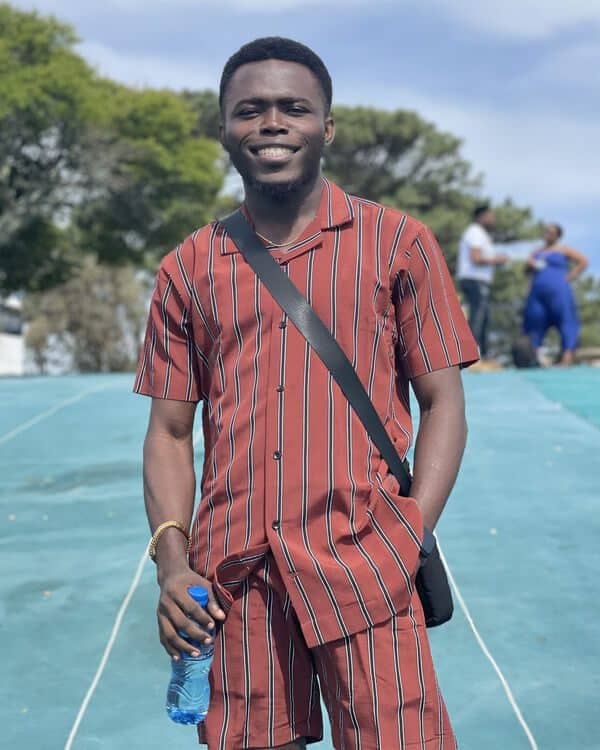 Femi in a smiling pose